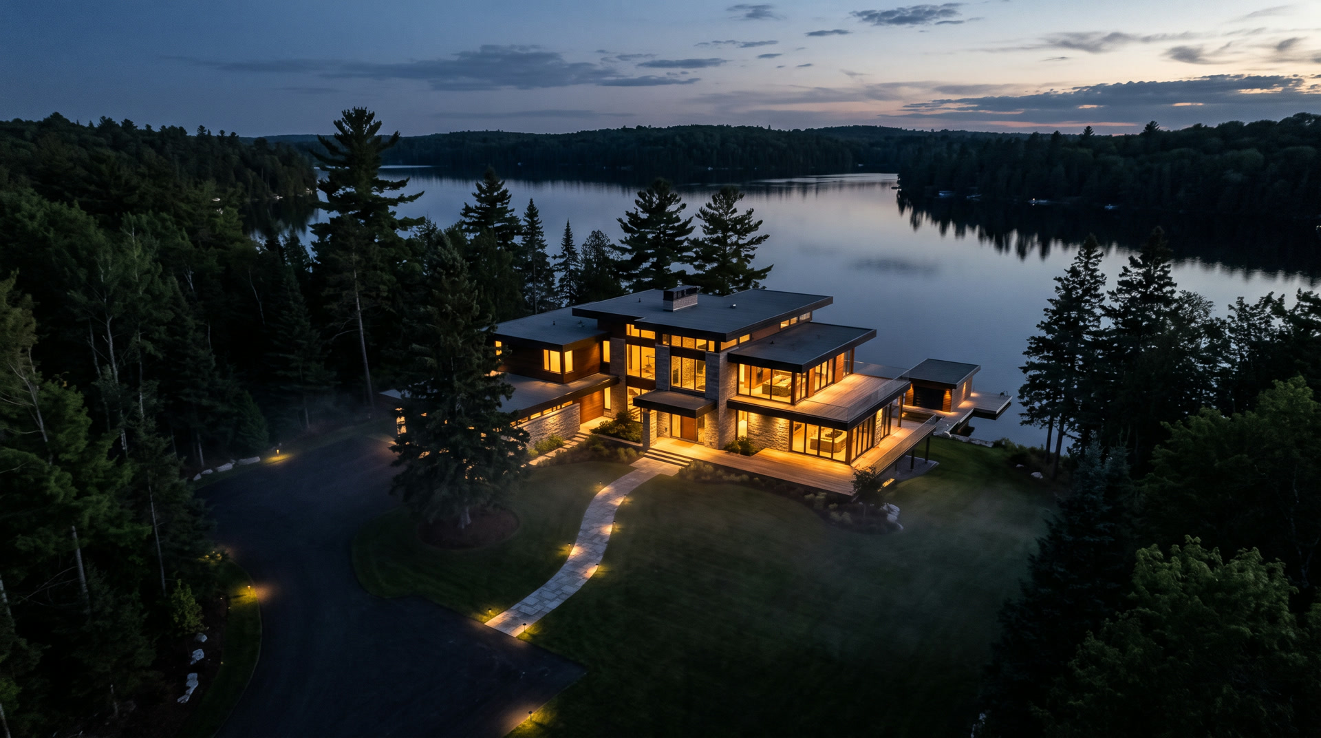 Aerial dusk view of the lakeside property